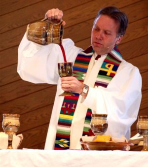 Paastor Bryan Serving Communion